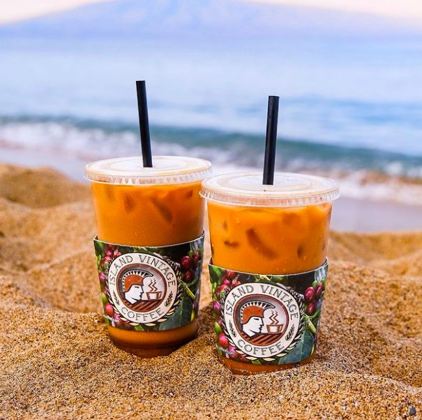 Island Vintage Coffee recently relocated from Ko Olina to Kapolei. So while it's not as easy to enjoy your iced coffee on the beach, like in this image, you can still make it work!